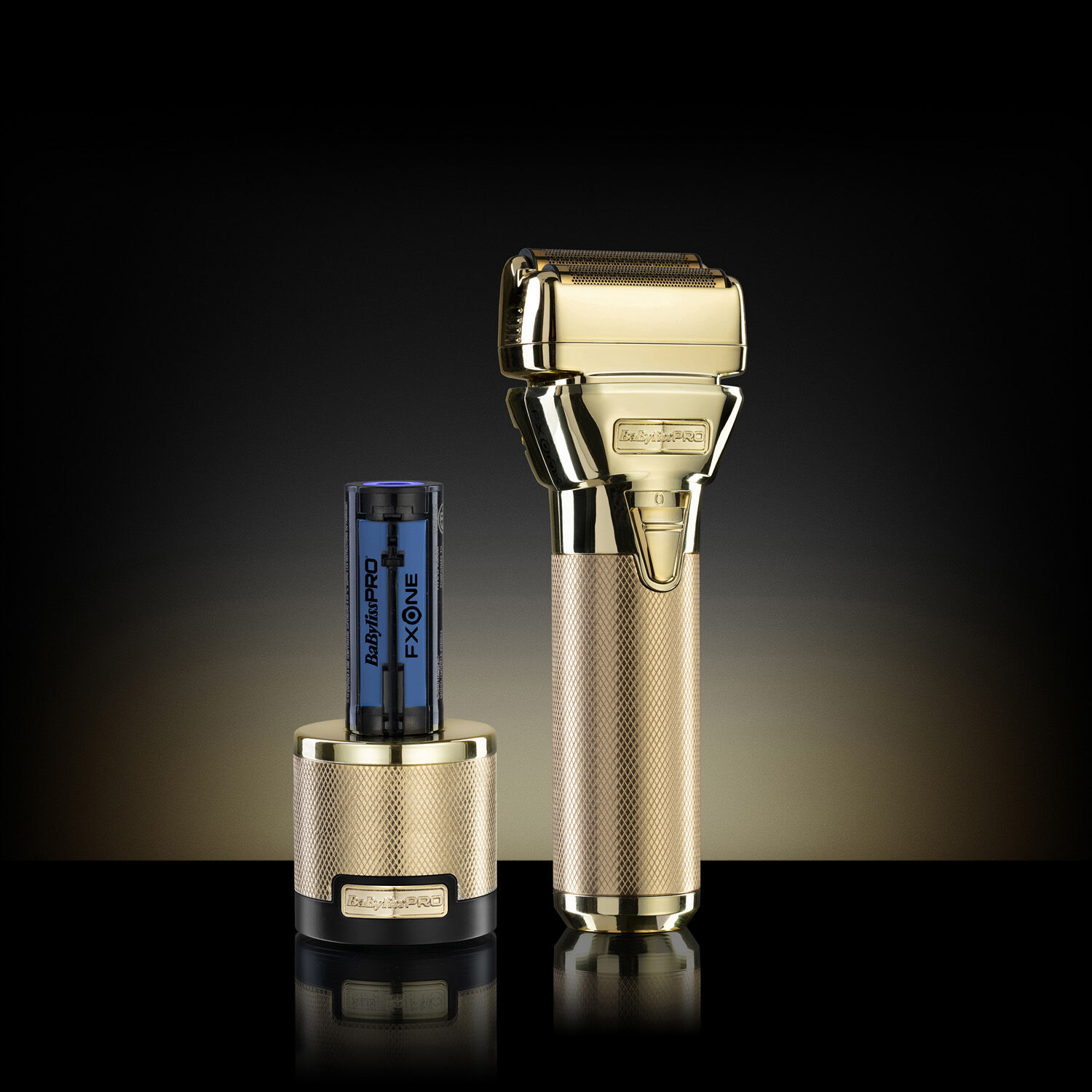 BaBylissPRO FXONE All-Metal Gold Shaver on a  dark background